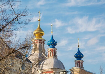 Domes and crosses of an Orthodox church against the blue sky