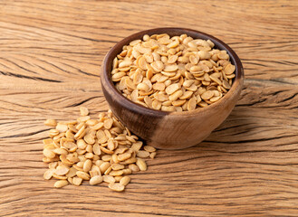 Fried soy beans snack in a bowl over wooden table