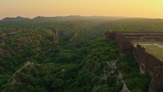 Aerial view of an ancient fort with green mountains