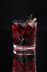 Cocktail in a glass on a black background