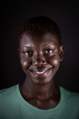 Obraz premium Beauty face. Smiling black woman portrait. Beautiful candid real face African American girl High quality photo