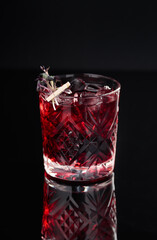 Cocktail in a glass on a black background