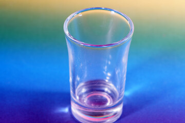 glass of water on blue
