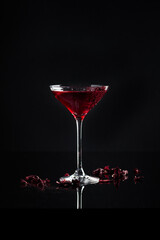 Cocktail in a glass on a black background