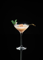 Cocktail in a glass on a black background