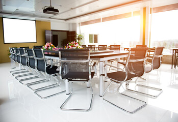 Conference table and chairs in meeting room.