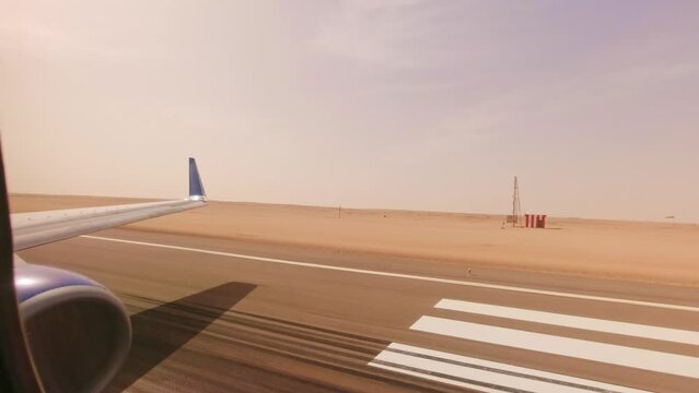 Airplane takeoff at Hurghada airport, view from the porthole. Aircraft preparation for flight. Jet maintenance: Egypt, Hurghada - 9 December, 2021