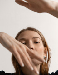 Fototapeta premium Fashion portraits of a stylish and tall model with makeup and hair