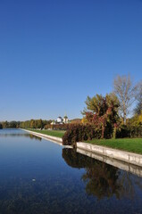 Fototapeta na wymiar Panoramic view of the Kuskovo estate and the pond. Clear sunny day.