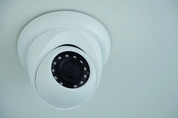 CCTV camera, white CCTV, black lens, for watching movements in the house, office