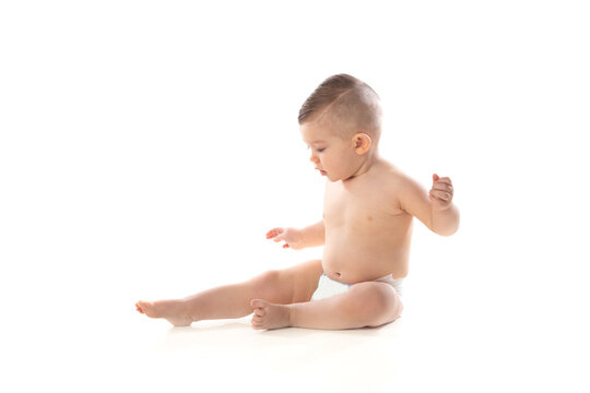 Funny child baby boy toddler naked in diaper
