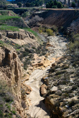 Fototapeta na wymiar The San Timeteo Canyon Creek Canyon near Yucaipa, California, where water has formed a Canyon River Valley with Run-Off Erosion 