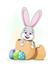 Cute rabbit sits in an egg with easter eggs