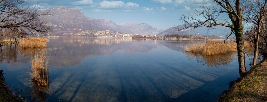 Panoramic view of an alpine lake in winter, Annone, Lombardy, Italy