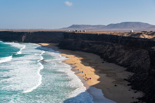 Aerial view of surfers on Esquinzo beach, El Cotillo, Fuerteventura, Canary Islands, Spain