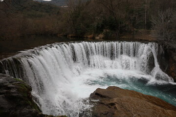 Obraz premium The Vis waterfall is a natural waterfall of the Vis, a tributary of the Herault, located in the municipality of Saint-Laurent-le-Minier, in the department of Gard, in the Occitanie region.