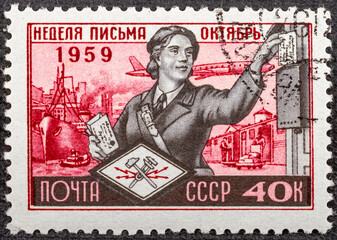 RUSSIA - CIRCA 1959: Stamp printed in USSR Russia shows Woman letter carrier, series International...
