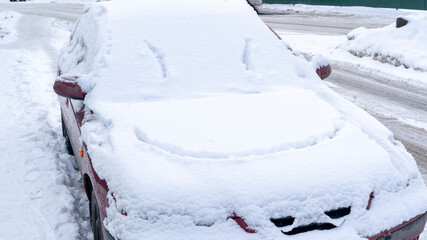 smile on a snow-covered car in the snow