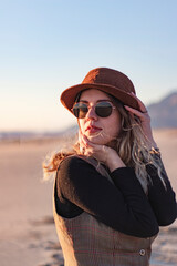 Girl in fancy, vintage, brown hat. Fashion, style. Close up portrait.	Perfect skin. Beauty and fashion concept.