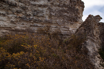 Stone mountains. Geological research near the sea. Natural background. Summer landscape.