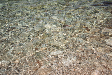 View of the calm sea from the height of the mountains. Beautiful seascape. Travel to the mountains. Summer rest. Rocks, cliffs, stones.