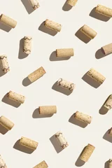 Foto op Plexiglas Creative pattern with wine corks on beige background with hard light and shadows at sunlight. Minimal style layout with bottle cap from red and white wine,  wine list backdrop © yrabota