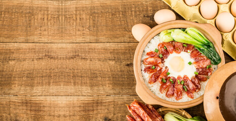 Cantonese style cooking of claypot rice with waxed meats
