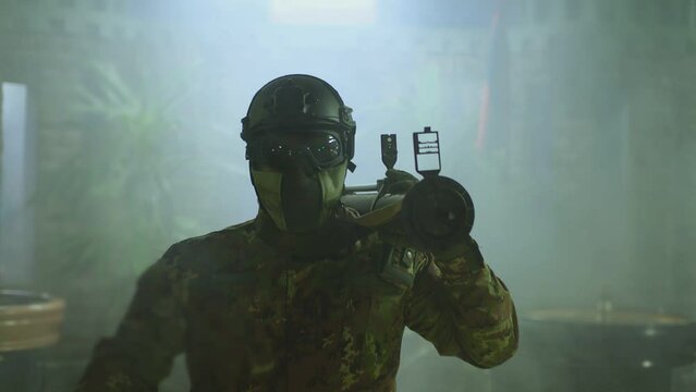 Private Military Company operator shoots from an RPG rocket launcher . Soldier with antitank grenade launcher . R. P. G. shooter shooting . Shot on ARRI movie camera in Slow Motion .