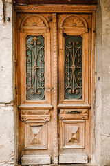 Old ancient door with forged iron details in historical part in the old town of Tbilisi, capital city of Georgia. Architecture.