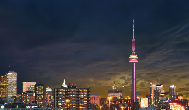 Toronto  - January 21, 2020: Downtown Toronto skyline  with famous CN tower at night. CN Tower is a global cultural icon of Canada 