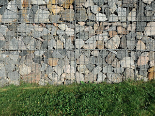 Gabion, a modular containment system made from wire mesh and filled with stones