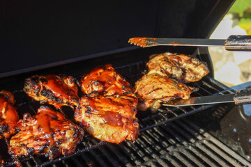 Delicious Barbecued Chicken on a Grill Roasting to Tenderness