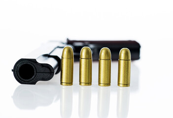 Gun with ammunition isolated on white background