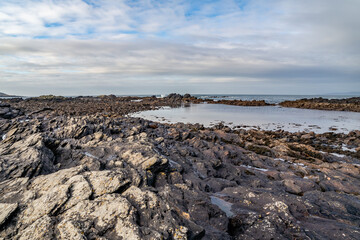 The rocks of Carrickfad by Portnoo at Narin Strand in County Donegal Ireland