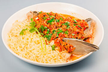 Steamed fish head with diced hot red peppers