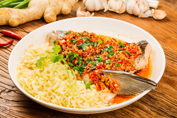 Steamed fish head with diced hot red peppers