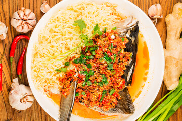 Steamed fish head with diced hot red peppers