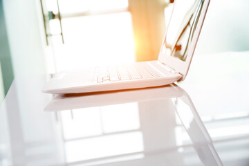 White laptop on the desk