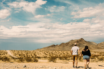 A man and woman looking out at the desert in Nevada.