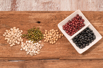 Mix pulse bean on wood background.