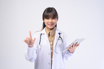 Young female doctor with stethoscope over white background