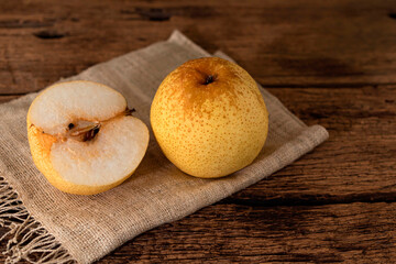 Healthy fruit food Chinese pear on wood table.