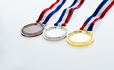 Set of gold silver and bronze award medals  on wooden table