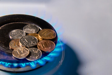Gas flame from a gas burner and ruble coins