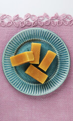 Mysore pak, a traditional, popular, and delicious sweet dish native to the city of Mysore, Karnataka, India, is made from ingredients like gram flour, ghee and sugar