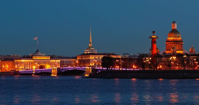 Russia, Saint-Petersburg in dusk, landmarks of city in night illumination, Rostral Columns, Palace Bridge, reflections on water, Admiralty building, Isaac cathedral