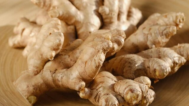 Whole ginger root on close up rotating 4K