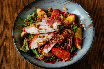 warm salad with meat and vegetables. restaurant menu