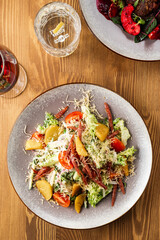 warm salad with meat and vegetables. restaurant menu