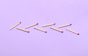 Herringbone pattern made of matches on color background